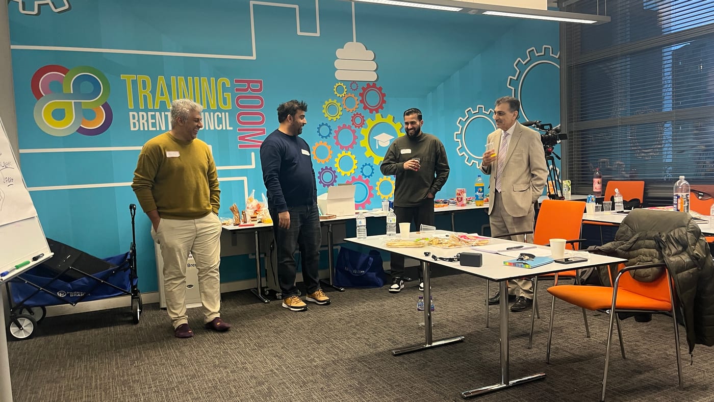 The Elevate cohort connecting inside the room